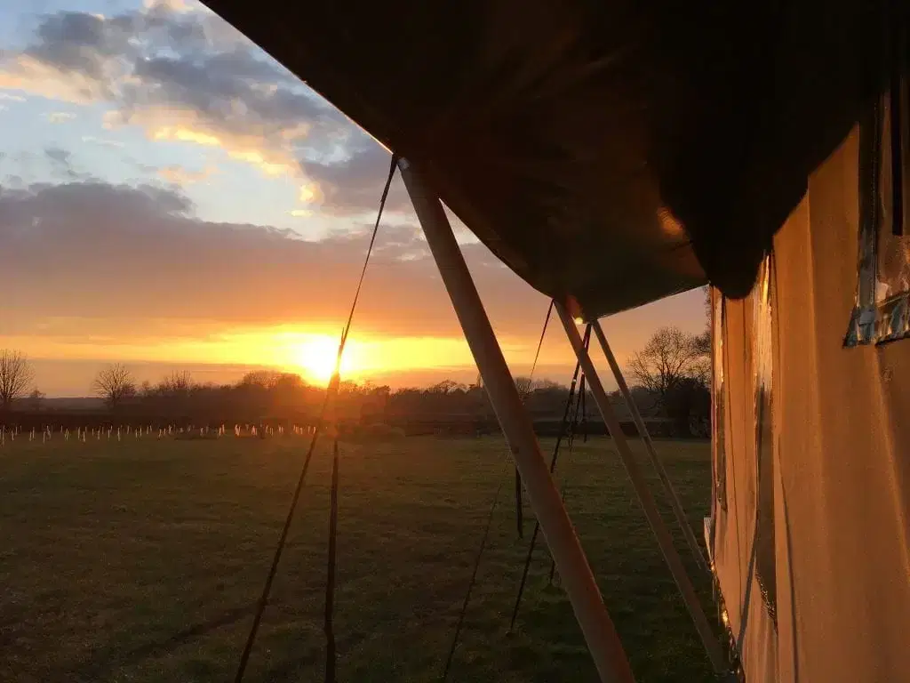 Beautiful orange sunset from the porch of a safari tent