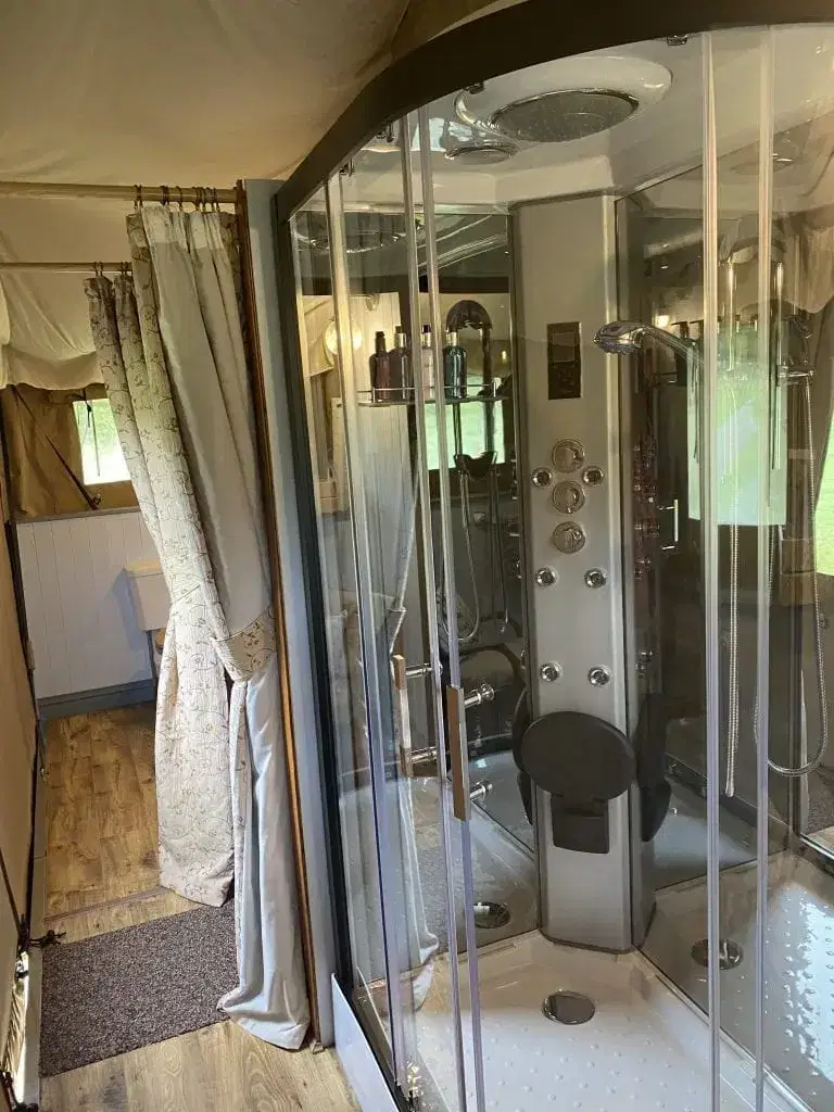 Shower pod with curtains separating areas