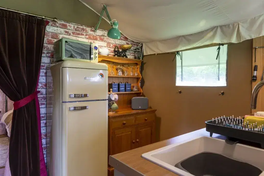 Kitchen with fridge, dresser and sink