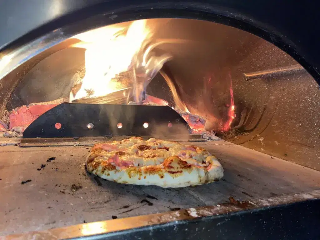 Pizza inside woodfired oven