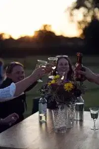 People celebrating at a table outside