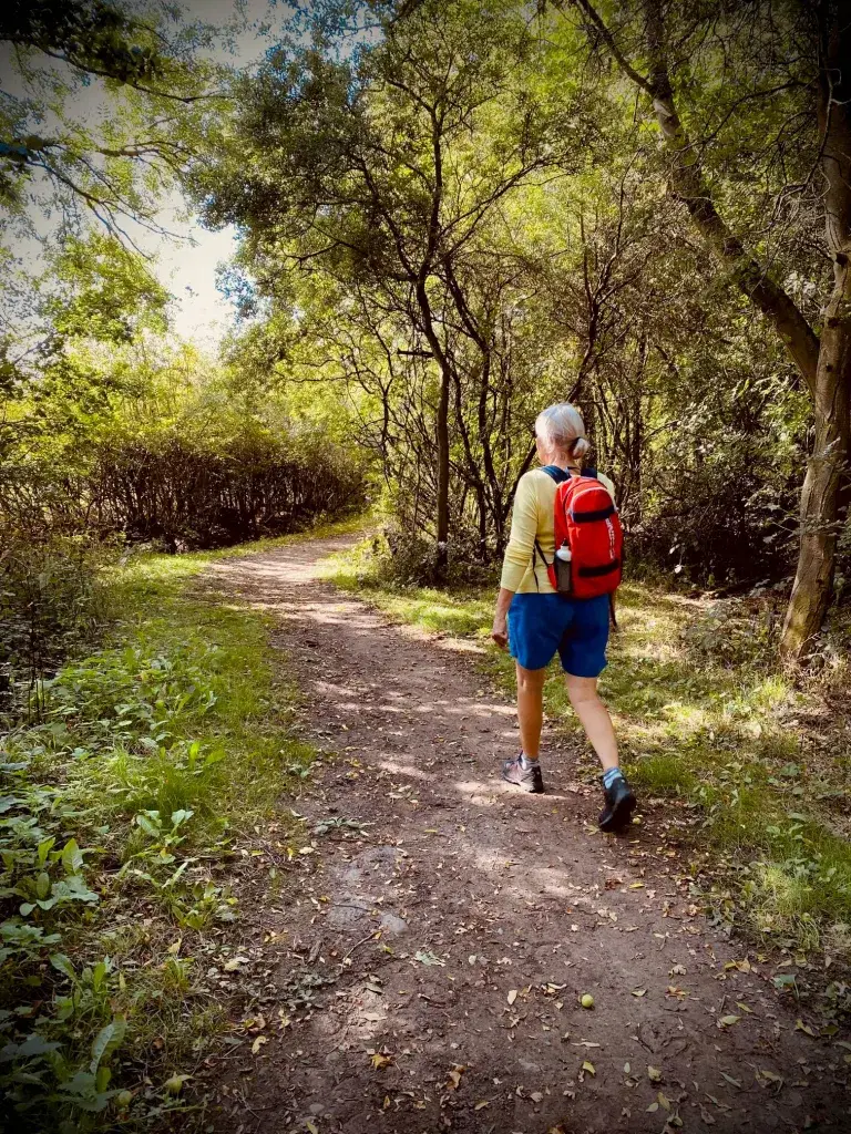 A lady hiking in the countryside