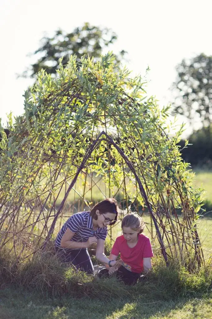 Children under a willow tent