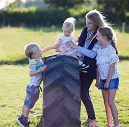 Family friendly children playing in field